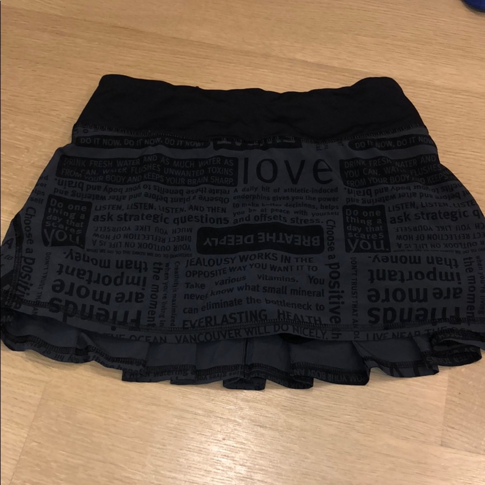 Black lululemon skirt with logo printed size 2